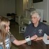 Ashlyn Russell is pictured getting her vital signs checked by CVC volunteer Lois Wood at the New Cambria clinic