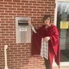 Macon County Collector Jeanette Ronchetto stands outside next to the new drop off box at the Collector's Office at the Macon County Courthouse.
